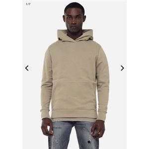 JOHN ELLIOTT HOODED VILLAIN